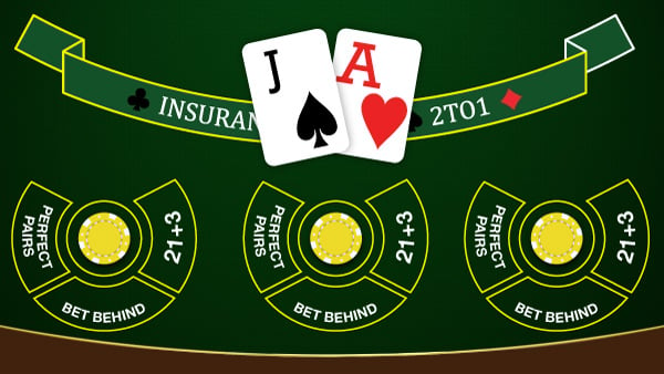 Top view of a blackjack casino table with two dealt cards and the options to place side bets.